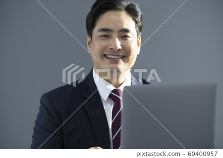 Businessman with laptop Businessman with laptop 60400957