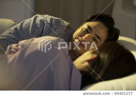 Couple facing the bedroom Couple facing the bedroom 60401257