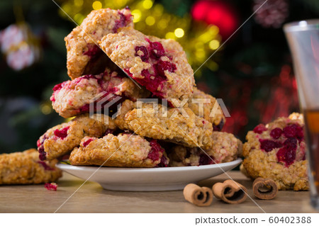 Christmas oatmeal biscuits on saucer and cup of tea Christmas oatmeal biscuits on saucer and cup of tea 60402388