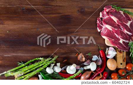 Natural background with raw beef, vegetables Natural background with raw beef, vegetables 60402724