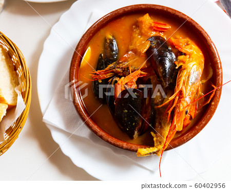 Peruvian seafood soup Parihuela 60402956
