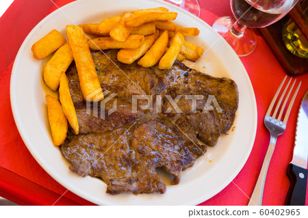 Lamb fillet with french fries Lamb fillet with french fries 60402965