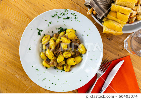 Gnocchi with aubergine and minced meat Gnocchi with aubergine and minced meat 60403074