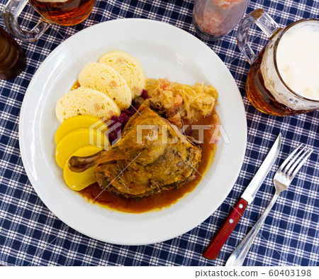 Grilled duck leg quarter with red and white cabbage Grilled duck leg quarter with red and white cabbage 60403198