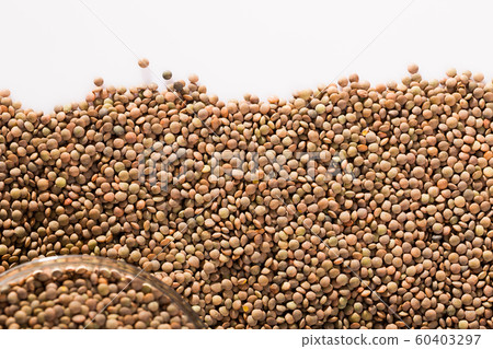 Raw lentils on white background Raw lentils on white background 60403297