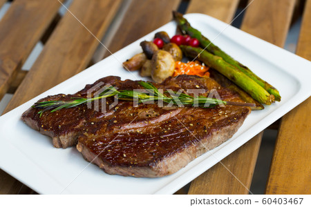 Photography of plate with beef entrecote with mushroom and asparagus 60403467