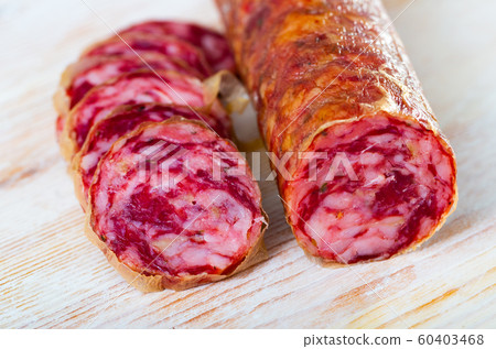 Close-up of spanish salchichon sausage at wooden surface 60403468