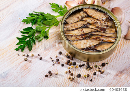 Sprats in oil with peppercorn, garlic, parsley Sprats in oil with peppercorn, garlic, parsley 60403688