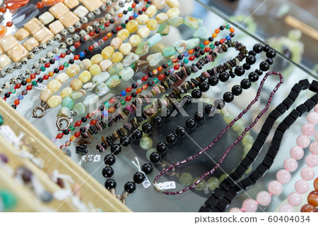 Necklaces from precious stones in jewelry store Necklaces from precious stones in jewelry store 60404034