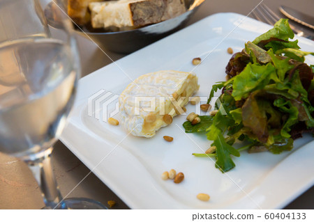 Cheese Saint Marcellin with pine nuts Cheese Saint Marcellin with pine nuts 60404133
