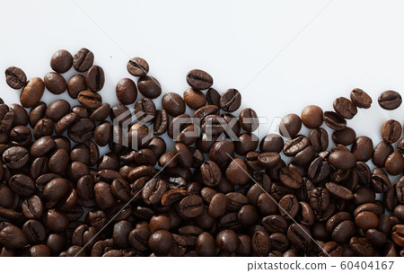 Coffee beans on white surface 60404167