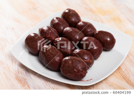 Morcilla on white plate 60404199