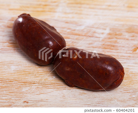 Morcilla on wooden table 60404201