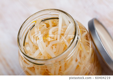 Glass jar of sprouted mung beans 60404219
