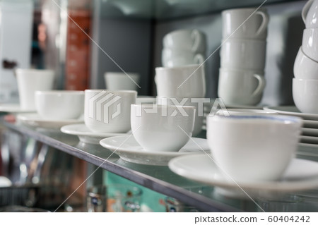 White ceramic cups in store White ceramic cups in store 60404242