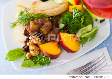 Salad with roasted chicken hearts, pears Salad with roasted chicken hearts, pears 60404282