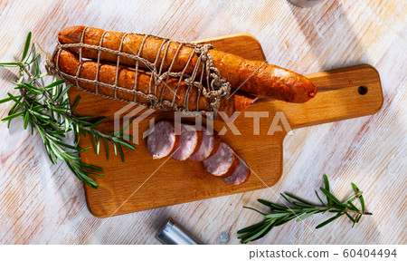Lean smoked ham sausage on wooden table Lean smoked ham sausage on wooden table 60404494