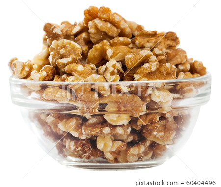 Glass bowl with walnuts Glass bowl with walnuts 60404496
