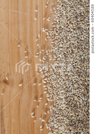 Pearl barley on a wooden surface, macro Pearl barley on a wooden surface, macro 60404589