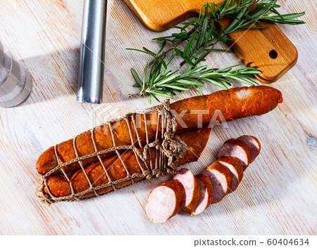 Lean smoked ham sausage on wooden table Lean smoked ham sausage on wooden table 60404634
