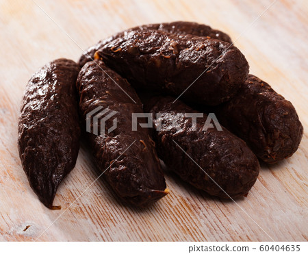 Blood sausages on wooden table Blood sausages on wooden table 60404635