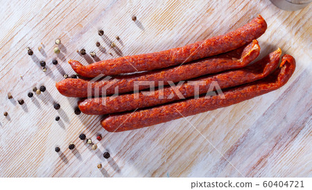 Appetizing smoked sausages for snacks Appetizing smoked sausages for snacks 60404721