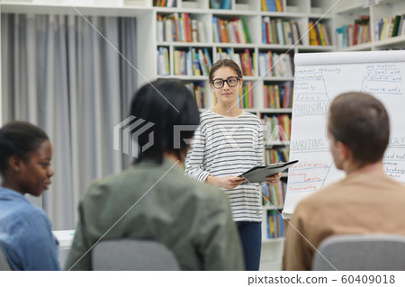 Young woman presenting her report 60409018