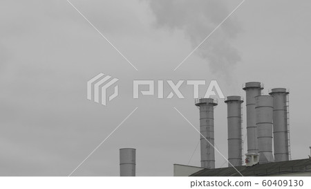 Pipes with smoke in a factory building 60409130