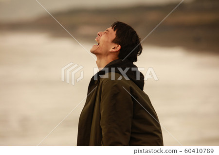 A man shouting to the sea A man shouting to the sea 60410789