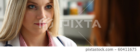 Smiling beautiful female medicine doctor explain Smiling beautiful female medicine doctor explain 60411675