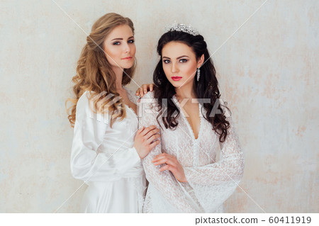 Portrait of two girls in white dresses wedding Portrait of two girls in white dresses wedding 60411919