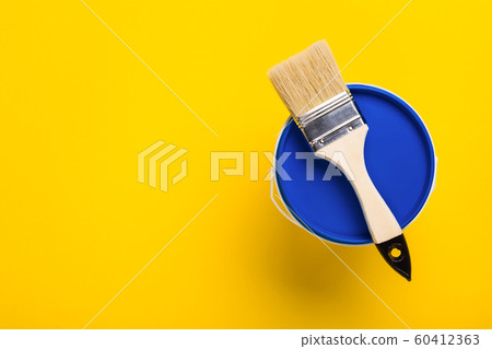 Closed bucket with phantom blue paint and brush. 60412363