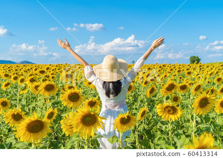 Portrait of happy Asian woman enjoying and Portrait of happy Asian woman enjoying and 60413314