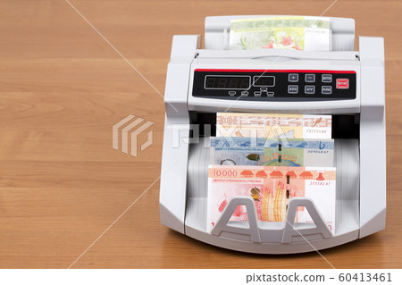 French Pacific Territories money in a counting machine 60413461