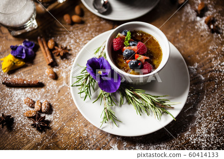 Avocado creme brulee served in a cup in restaurant Avocado creme brulee served in a cup in restaurant 60414133