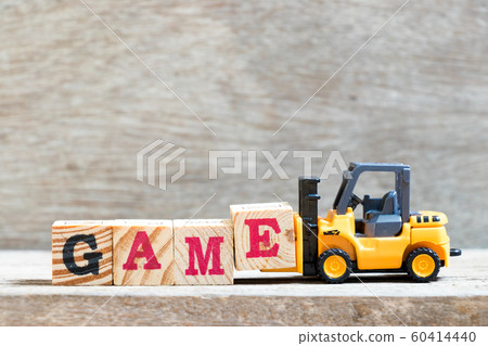 Toy forklift hold letter block e to complete word game Toy forklift hold letter block e to complete word game 60414440