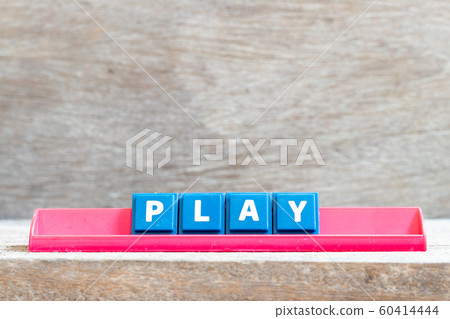 Tile letter on red rack in word play on wood background  60414444