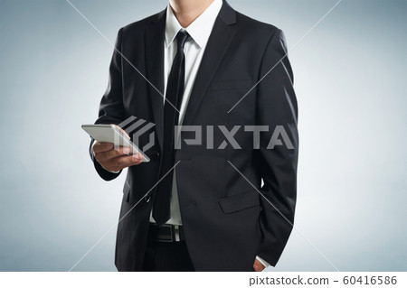 Close up of a businessman man using mobile smart phone Close up of a businessman man using mobile smart phone 60416586