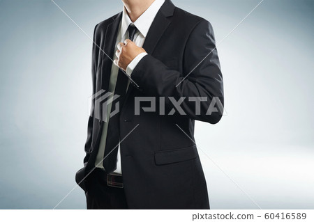 Confidence businessman in black suit , close up . Confidence businessman in black suit , close up . 60416589