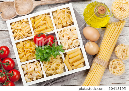 Various pasta in wooden box 60418195