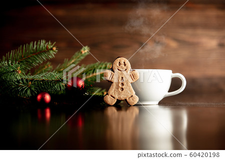 Cup of coffee and gingerbread man cookie Cup of coffee and gingerbread man cookie 60420198