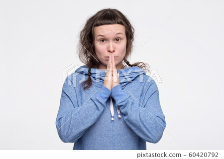 Caucasian pretty female teenager asking for help begging for mercy. Caucasian pretty female teenager asking for help begging for mercy. 60420792