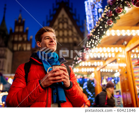 Young boy with drink on Christmas market Young boy with drink on Christmas market 60421846