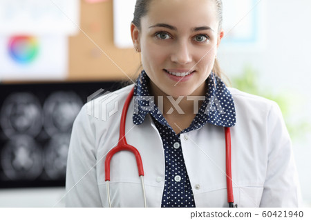 Cheerful attractive female at working place Cheerful attractive female at working place 60421940