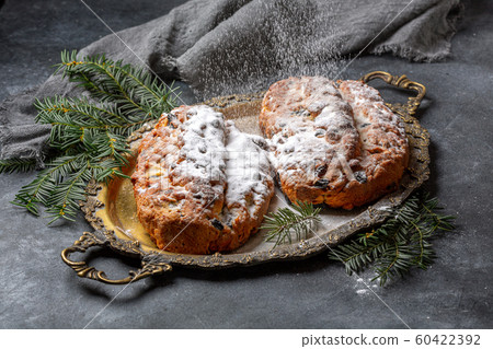 Traditional Stollen sprinkled with powdered sugar. 60422392