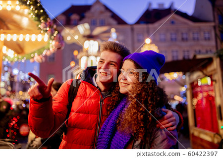 happy young couple have fun on Christmas market happy young couple have fun on Christmas market 60422397