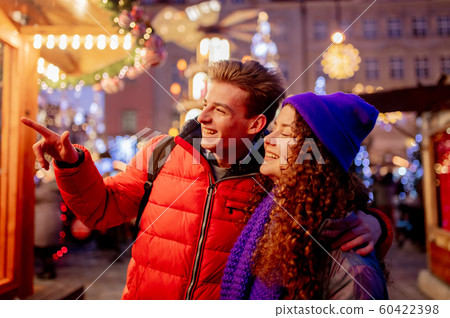 happy young couple have fun on Christmas market 60422398