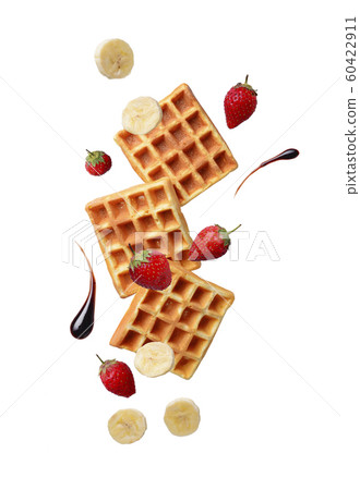 Belgium waffles with strawberries and banana Belgium waffles with strawberries and banana 60422911