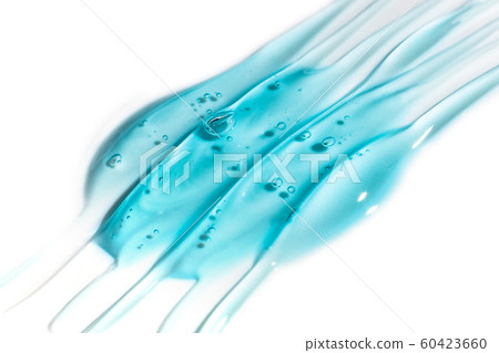 Squeezed cosmetic clear cream gel texture Iisolated on white background. Close up photo of transparent drop of skin care product. High Quality transparent gel serum with bubbles on white background 60423660