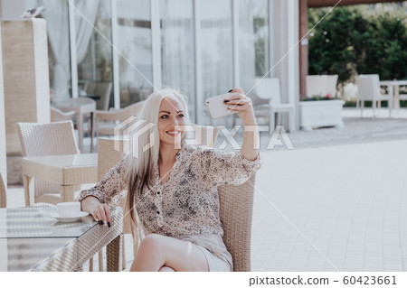 a girl takes pictures of yourself on your phone 60423661